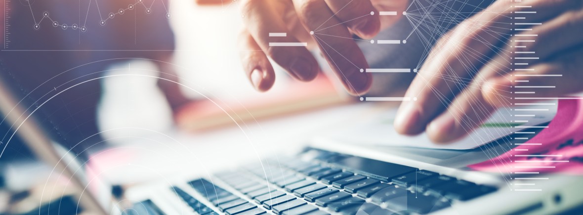 Man's hands working on laptop