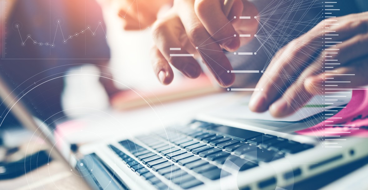 Man's hands working on laptop